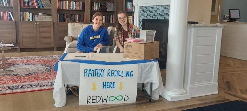 Cape High juniors Anna Kucharik, left, and Abby Stinar collect batteries and electronics at Coastal Club. SUBMITTED PHOTO